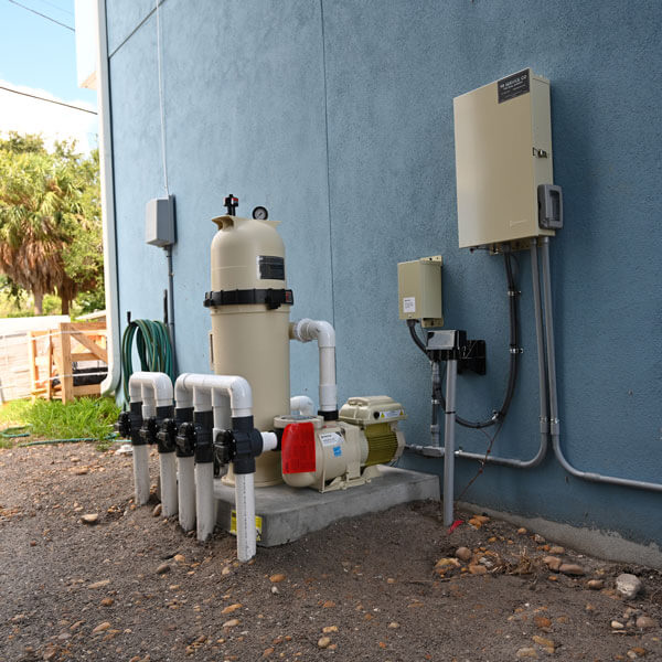 panels and pipes behind home