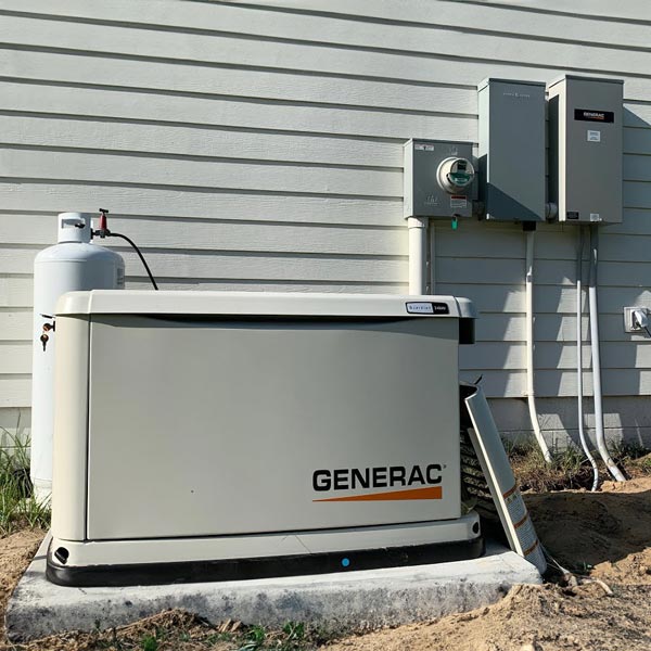 Generac home generator next to house