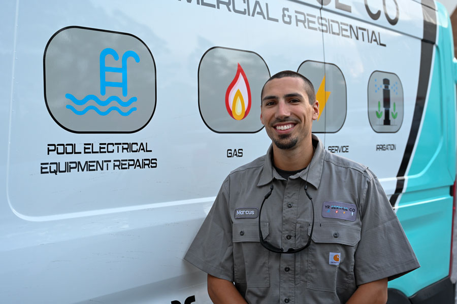 Employee beside a van